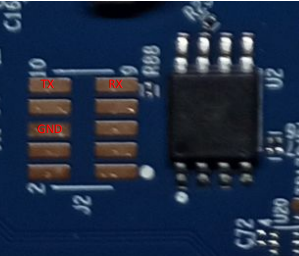 Close-up of the UART TX, RX, and GND pins on the Eero board
